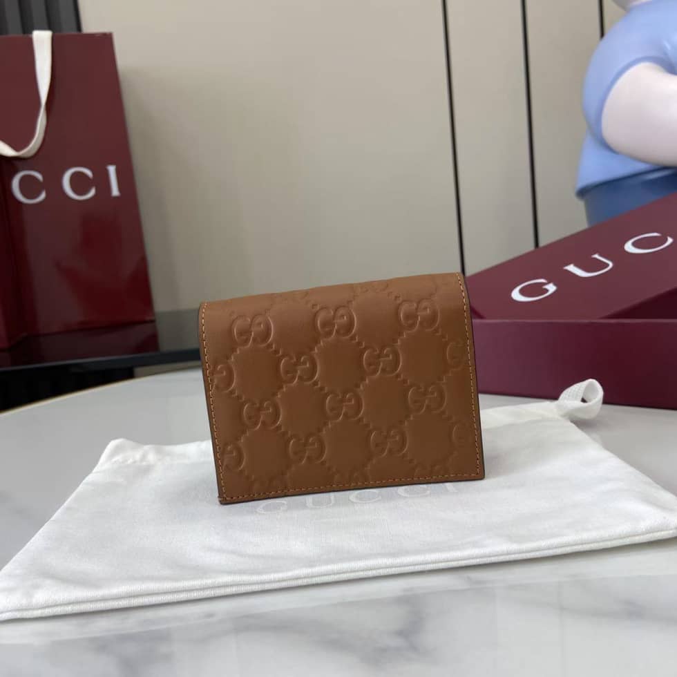 Gucci GG Emblem Bifold Brown Wallet 847207_1_157920 Gucci GG Emblem Bifold Brown Wallet 847207